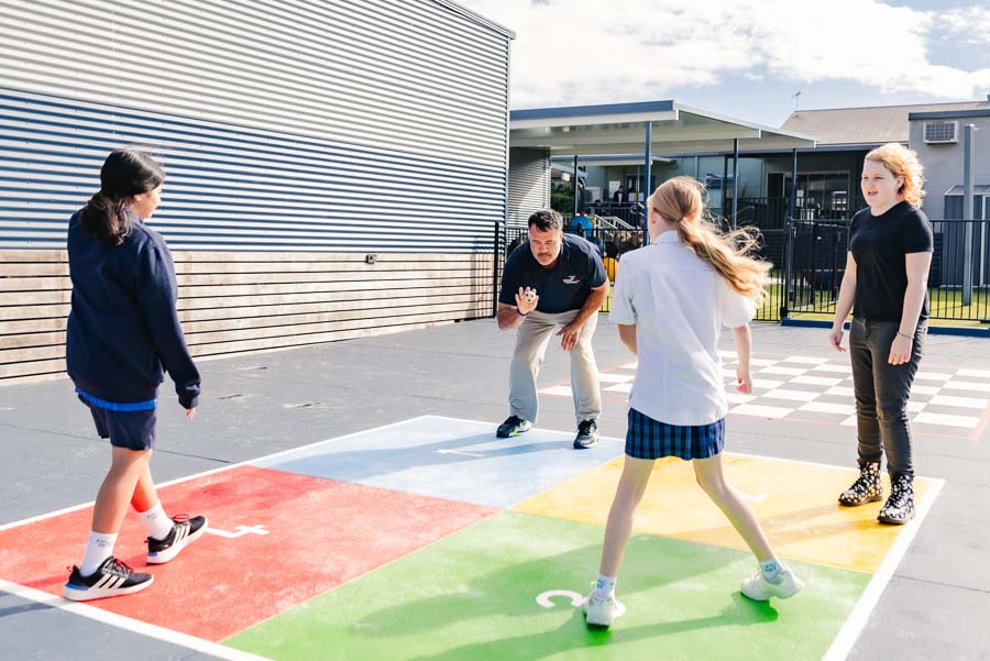 Energetic students enjoying a friendly game of handball