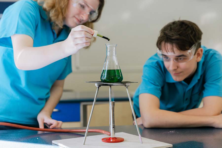 Students participating in a science lesson engaged in hands-on learning.
