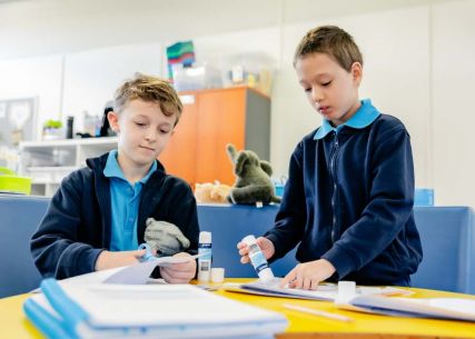 Students working together on a craft project