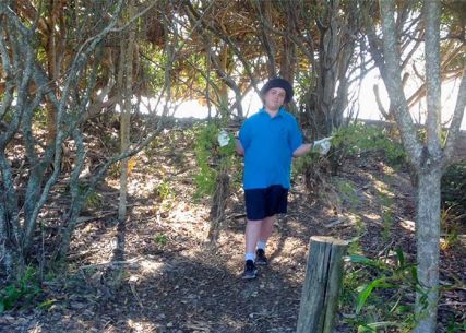 Students participating in mangrove restoration activities.