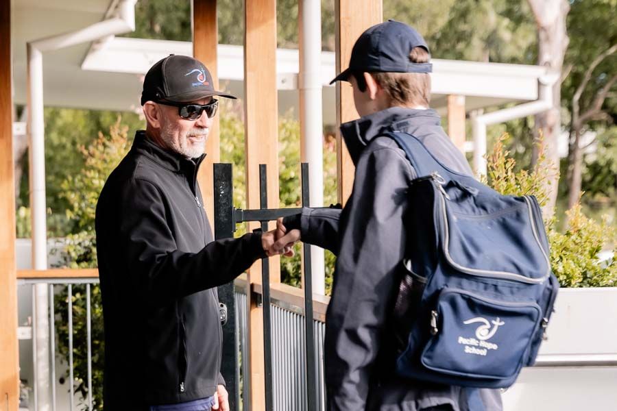 A warm welcome as a student arrives at school